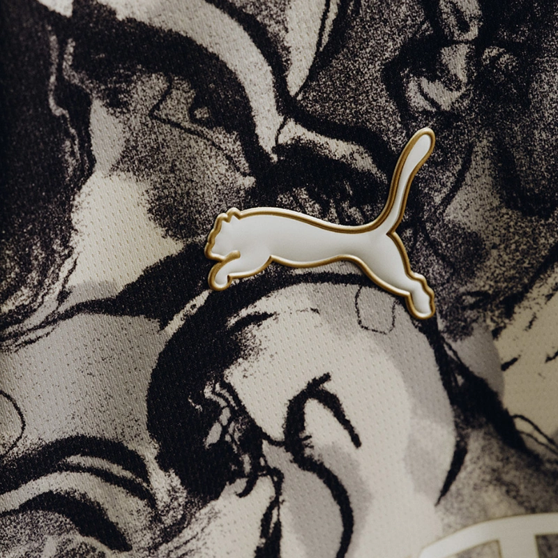 Close-up of the PUMA logo on the Manchester City Year of the Horse 2026 pre-match jersey.